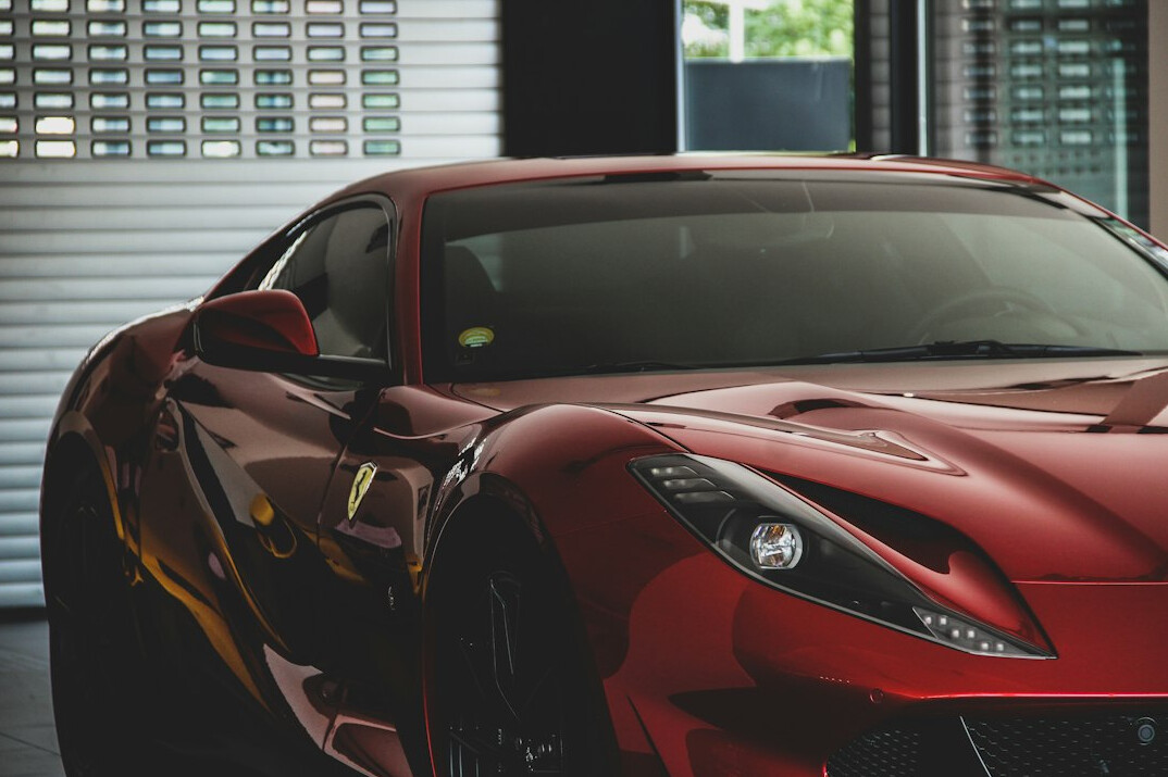 Dark luxury sedan in a private garage