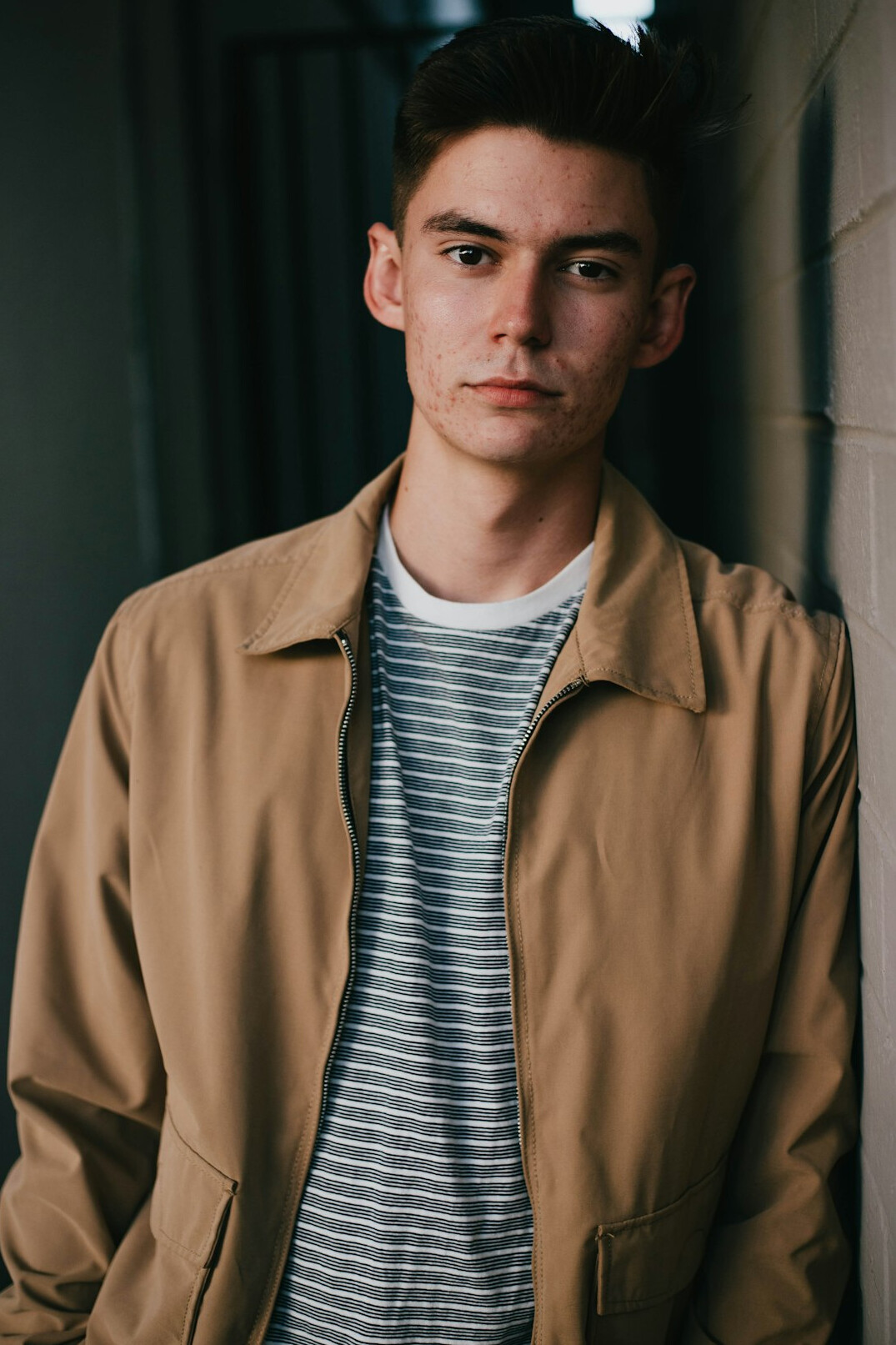 Portrait of a man with short hair in a casual jacket